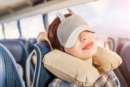 Woman,In,Sleep,Mask,And,With,Pillow,Travelling,In,Bus